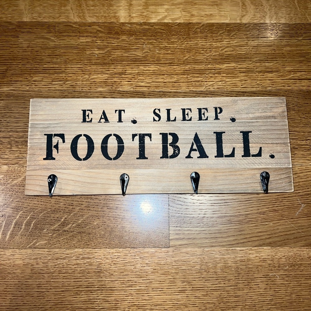 football sign with hangers